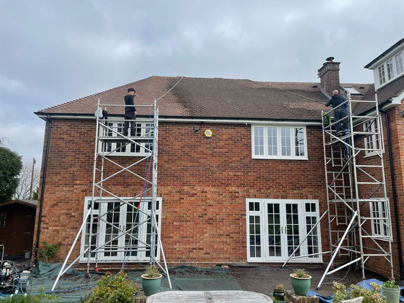 Roof cleaning carried out safely from scaffold towers by The Roof Moss Cleaners in Ringwood